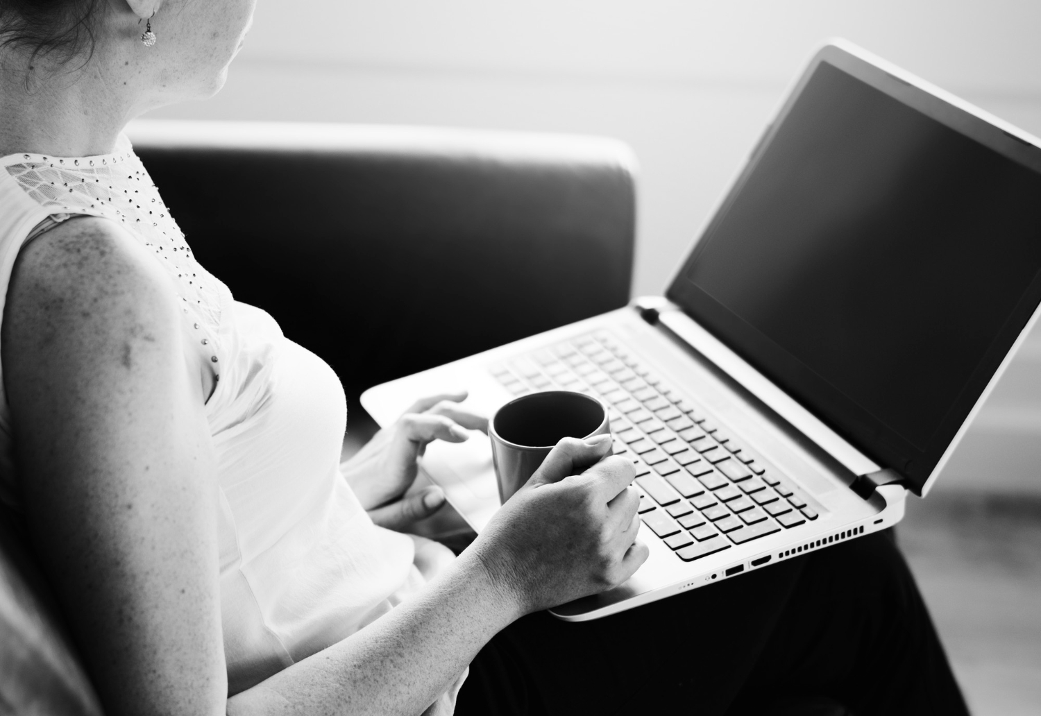 A person sitting in a chair holding a tablet, with a digital search bar graphic overlaid in front of them.