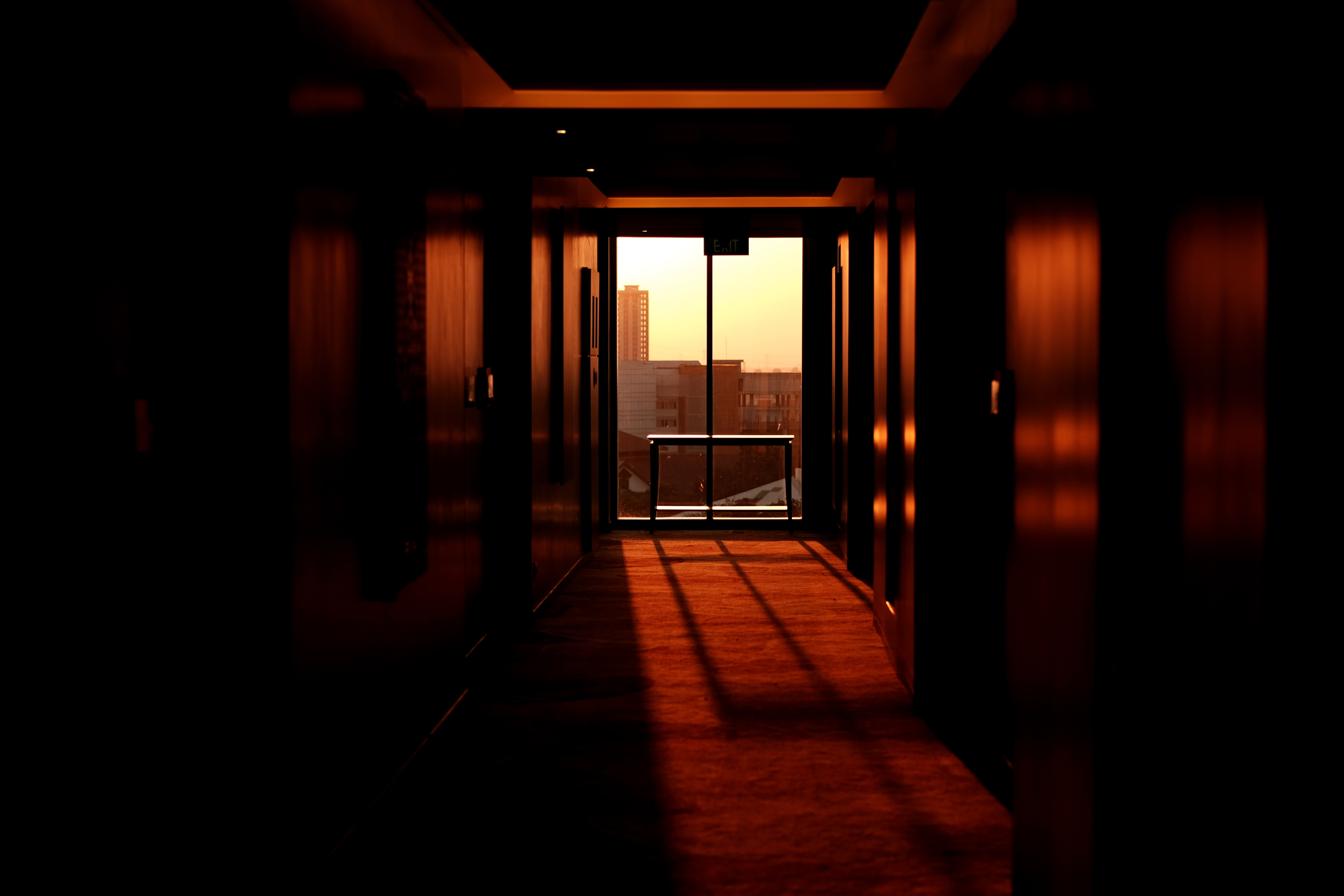 The sunset coming through the windows of a hotel